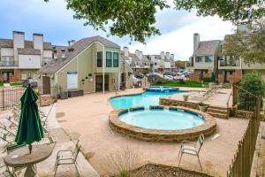 a pool in a yard with chairs and a table at Cozy Fort Worth Condo Close to Downtown! in Fort Worth
