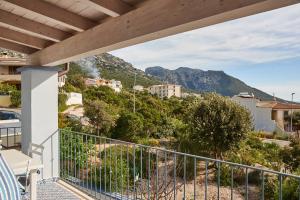 a balcony with a view of a mountain at Casa Azzurra in Cala Gonone