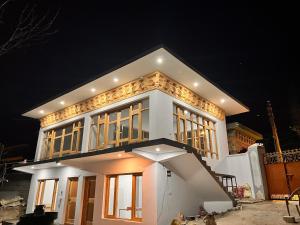 a house is being built at night at Chubar Home in Leh