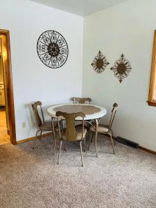 a dining room with a table and chairs at 2BR Erie Flat Near Gannon & Mercyhurst in Erie