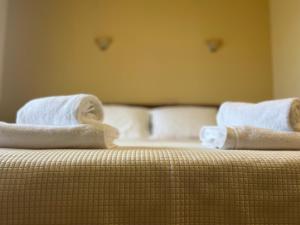 Postel nebo postele na pokoji v ubytování Agnanti Zitsas Hotel