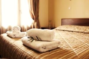 Postel nebo postele na pokoji v ubytování Agnanti Zitsas Hotel