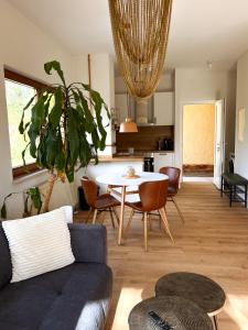 a living room with a couch and a table at Nomad Nest in Michelbach an der Bilz