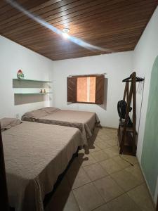En eller flere senge i et værelse på Arraial Casa Vista Alegre