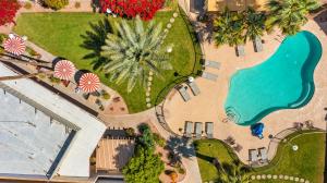 an overhead view of a park with a swimming pool at Papago Motor Hotel in Scottsdale