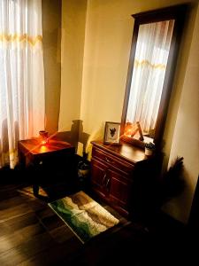 a living room with a table and a window at Serene Stay in Kurunegala
