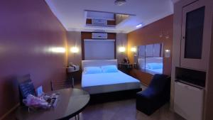 Tempat tidur dalam kamar di Swing Motel 1