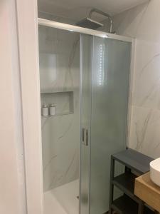 a shower with a glass door in a bathroom at AngelHome Matera in Matera +3 photos