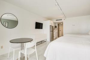 A television and/or entertainment centre at Ocean Views and Resort Perks Sunny Isles Beach Unit