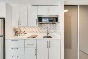 A kitchen or kitchenette at Ocean Views and Resort Perks Sunny Isles Beach Unit
