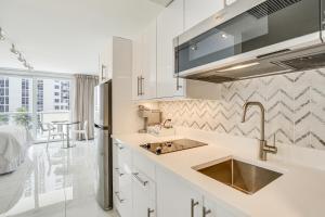 A kitchen or kitchenette at Ocean Views and Resort Perks Sunny Isles Beach Unit