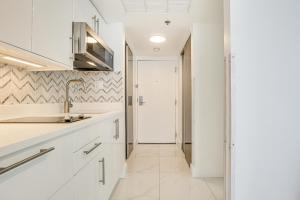 A kitchen or kitchenette at Ocean Views and Resort Perks Sunny Isles Beach Unit