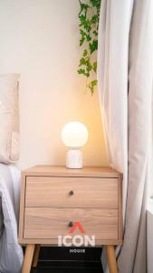 a nightstand with a lamp on it next to a bed at Beautiful Studio in Barranco in Lima