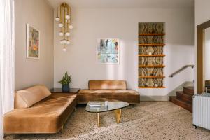 a living room with a couch and a table at Beverly Terrace powered by Sonder in Los Angeles