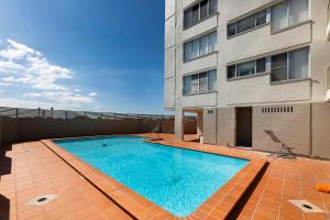 a swimming pool on the roof of a building at Ebbtide Unit 33 in Forster