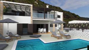 a rendering of a villa with a swimming pool at Anassa Mare Villas & Residences in Gaios