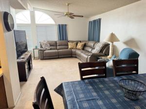 a living room with a couch and a table at Sagebrush Supreme in Parker