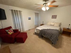 a bedroom with a bed and a ceiling fan at Sagebrush Supreme in Parker