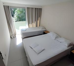 Postel nebo postele na pokoji v ubytování Flat BeloLar Garagem Hakka Feirinha e Hospitais + 49 fotografií