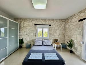 Postel nebo postele na pokoji v ubytování Four Seasons - The Eco Friendly Villa
