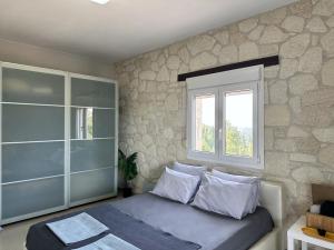 Postel nebo postele na pokoji v ubytování Four Seasons - The Eco Friendly Villa