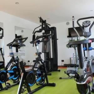a gym with several exercise bikes in a room at Isa Victory Hotel Boutique in Armenia