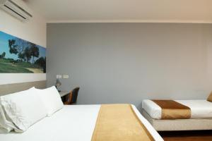 Hotel Portón Sabaneta客房内的一张或多张床位