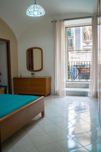 Postel nebo postele na pokoji v ubytování AUTENTICA NAPOLI HOME