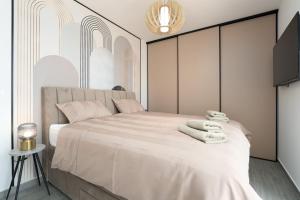 Ένα ή περισσότερα κρεβάτια σε δωμάτιο στο Apartment Arbora by SeeAdria Agency