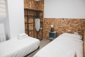 เตียงในห้องที่ Casa San Juan - Habitaciones privadas Logroño