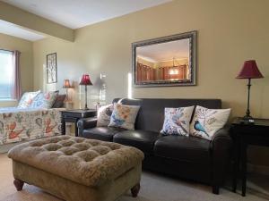 a living room with a couch and a chair at Gatlinburg Summit Studio for 2 With Amazing View! in Gatlinburg