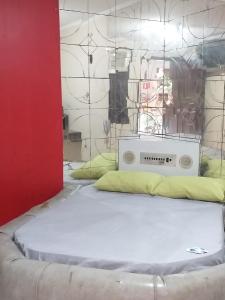 a room with a bed with a radio on it at House1963. in Santo André