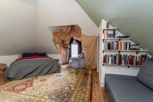 a bedroom with a bed and a book shelf at Centrally Located With Lake Views in Burlington