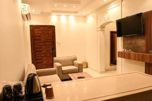 TV a/nebo společenská místnost v ubytování Buyot Malath Serviced Apartment - شقق بيوت ملاذ للشقق المخدومة