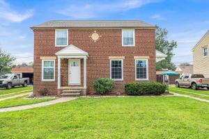 a brick house with a lawn in front of it at Renovated Brooklyn Townhome 9 Miles from Downtown in Brooklyn