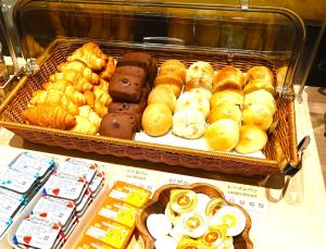 a display of different types of pastries in a store at Iroha Grand Hotel Kintetsu Nara Ekimae in Nara