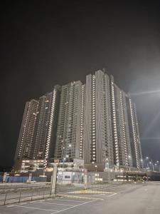 a tall apartment building at night with a street in front at Sweethome Mummy@Youthcity Nilai in Nilai
