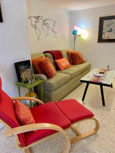 a living room with a couch and a table at Funky Downtown Pad Pets OK Near Intercoastal in Saint Augustine