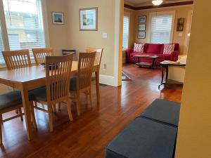a living room with a table and chairs and a couch at Kid and Pet friendly Downtown Home Walk Everywhere in St. Augustine