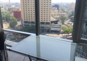 Nespecifikovaný výhled na destinaci Mexiko nebo výhled na město při pohledu z apartmánu