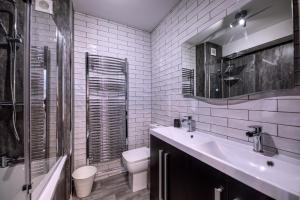 Koupelna v ubytování Bay View Holiday Apartments + 7 fotografií