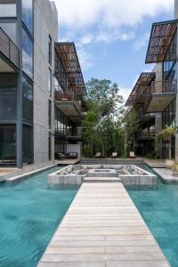 La alberca dentro o cerca de Ideal Location with Cenote Pools Gym Restaurant