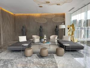 a living room with a couch and chairs and a table at NEW Nautico with Marina View and Rooftop Pool plus Gym in Puerto Vallarta +23 photos