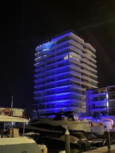 a building with blue lights on it at night at NEW Nautico with Marina View and Rooftop Pool plus Gym in Puerto Vallarta