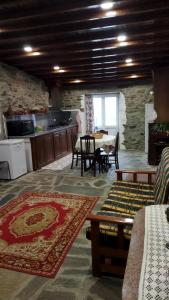 a living room with a table and a dining room at O Recanto do Sobreiro in Vale de Porco