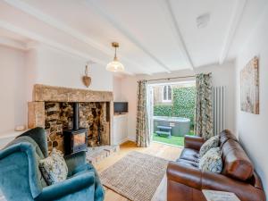 a living room with a couch and a fireplace at Thirlwell in Ridingmill