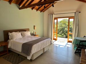 Ένα ή περισσότερα κρεβάτια σε δωμάτιο στο Villaggio da Mata