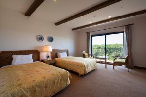 a hotel room with two beds and a large window at Hotel Shima Spain Mura in Shima +19 photos
