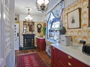 a kitchen with a counter and a stove at St Marys Chambers in Mold