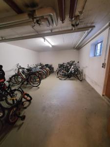a room with a bunch of bikes parked in it at Ferienwohnung Hedy in Prien am Chiemsee